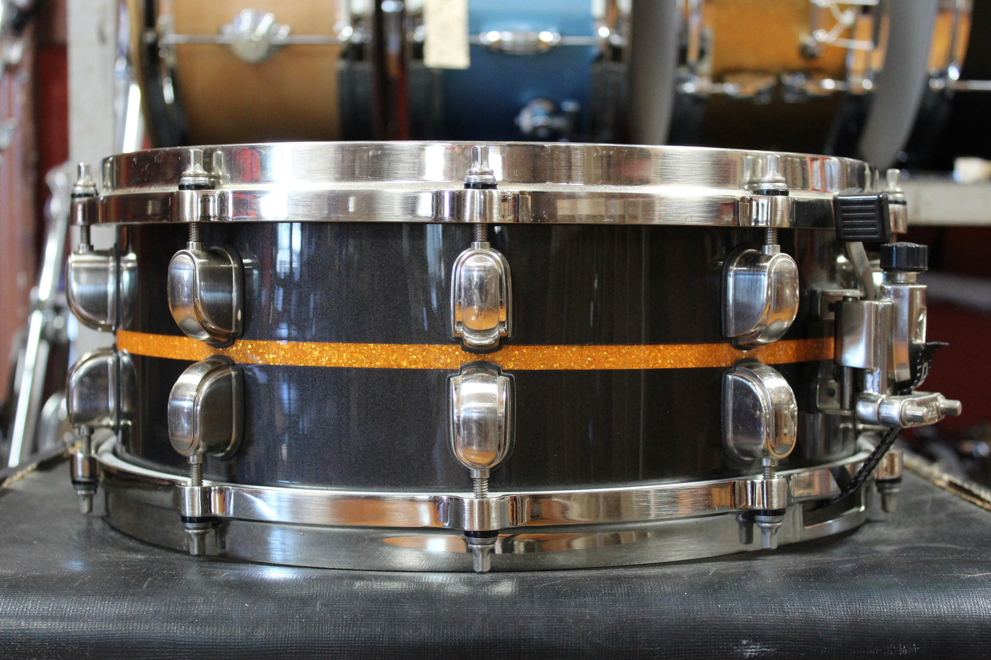 Tama 5.5x14 Starclassic Bubinga Elite Snare Drum in Metallic Black with Gold Inlay
