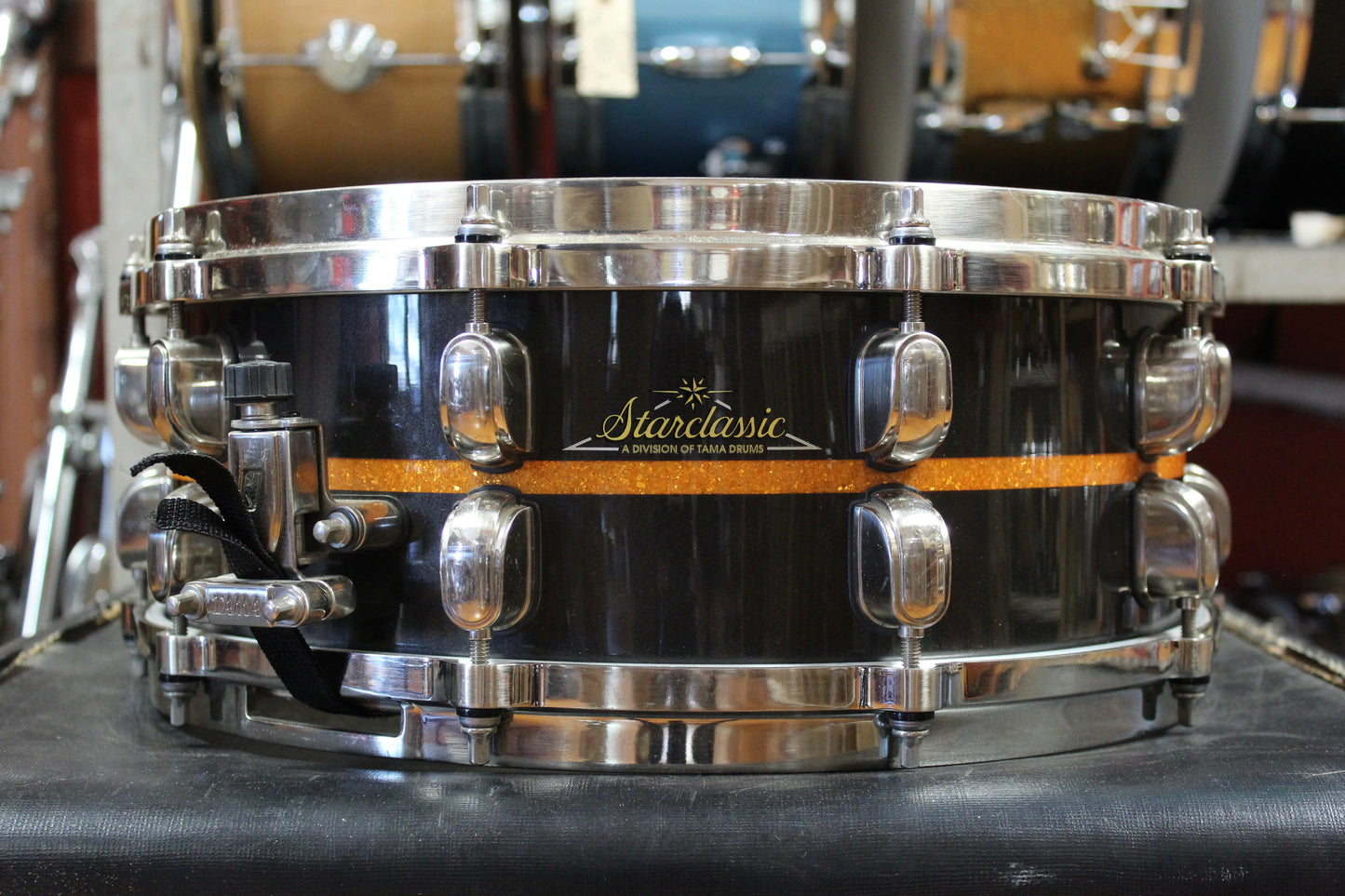 Tama 5.5x14 Starclassic Bubinga Elite Snare Drum in Metallic Black with Gold Inlay