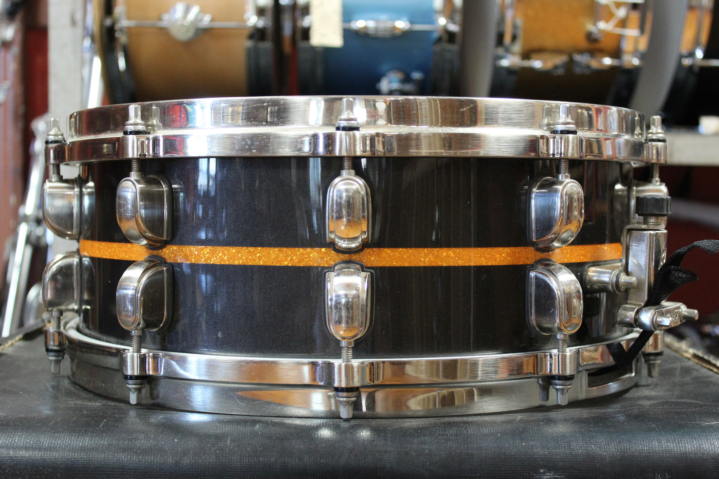 Tama 5.5x14 Starclassic Bubinga Elite Snare Drum in Metallic Black with Gold Inlay