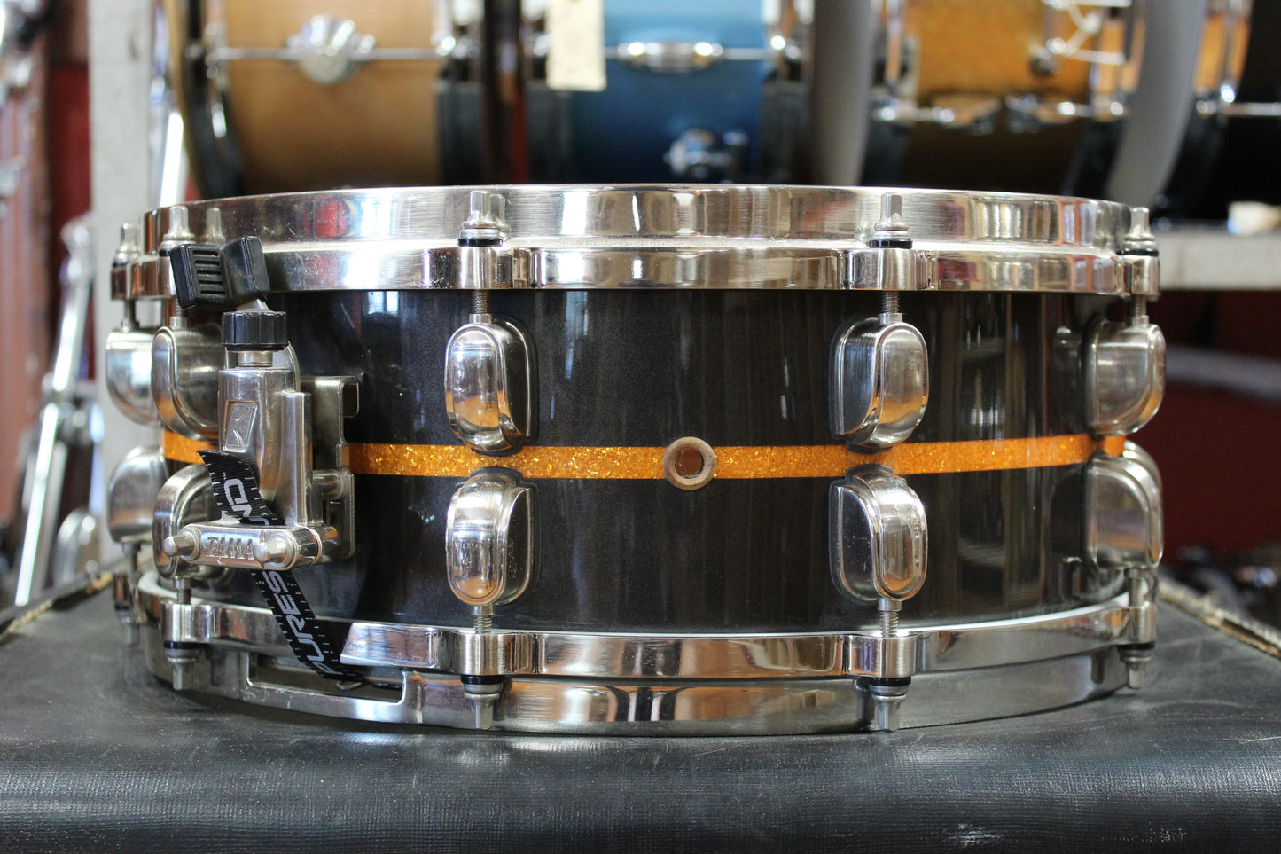Tama 5.5x14 Starclassic Bubinga Elite Snare Drum in Metallic Black with Gold Inlay